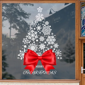 Christmas tree window sticker with white snowflakes and red bow for holiday decoration