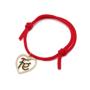 Minimalist red woven Milan rope bracelet featuring a gold heart Fe faith pendant