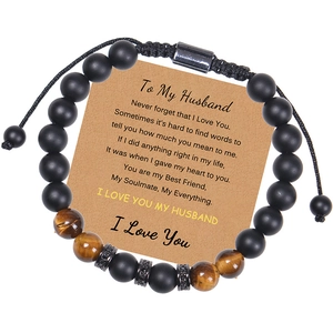 Detail of tiger eye and matte black beads bracelet with adjustable woven cord and gift card
