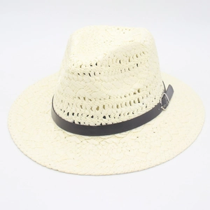 Close-up of beige woven Panama hat texture with black leather belt and silver metal buckle