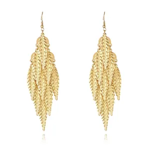 Detailed macro of 18k gold plated multi-layer leaf tassel drop earrings with hook