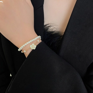 Elegant gold plated double-layer bracelet with white camellia pendant and pearls
