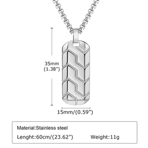 Macro view of geometric tire tread pattern on stainless steel pendant for men