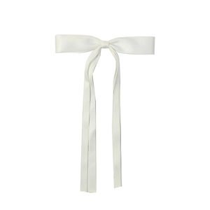 Detailed view of the smooth white satin ribbon bow hair clip with a silky texture