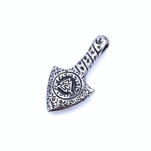 Close-up of silver Viking Valknut axe pendant with intricate Nordic rune textures