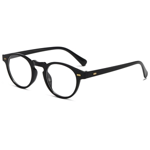 Détail de lunettes rondes vintage noires avec rivets dorés et pont en trou de serrure