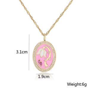 Detailed view of pink enamel oval pendant necklace with dimensions 3.1cm by 1.9cm