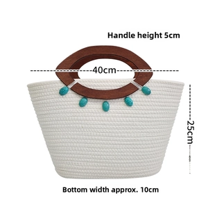 Detail of white woven tote with dark wooden handles and turquoise bead accents