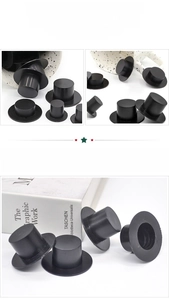 Macro detail of miniature black plastic magician hats for DIY snowman crafts and doll decor