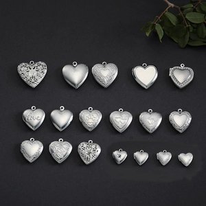 Selection of stainless steel heart photo lockets featuring engraved patterns and love text