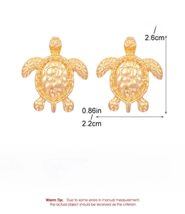 Detail view of golden turtle earrings with precise size and weight specifications
