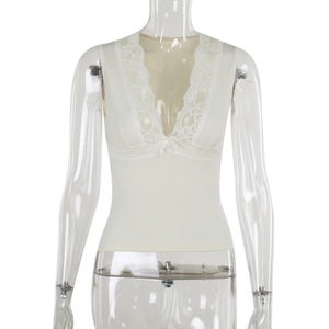 Detailed view of the deep V-neckline with lace trim and bow knot on a white ribbed vest