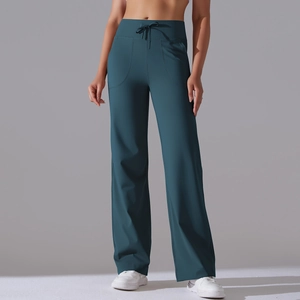 Detail of high waist yoga wide-leg pants in dark teal with drawstring and side pockets