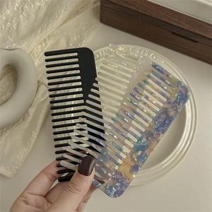 Vintage acetate wide tooth hair combs in solid black and colorful tortoise shell resin