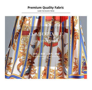 Detailed close-up of retro baroque print fabric with golden chain motifs and vivid colors