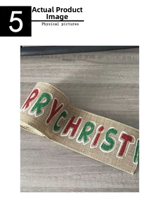 Macro detail of natural burlap Christmas ribbon with red and green glitter lettering