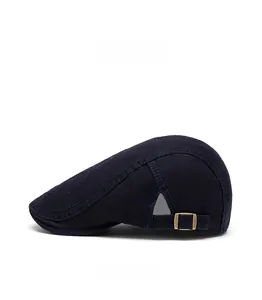 Detail view of adjustable metal buckle on navy blue cotton flat cap with side stitching