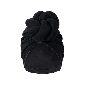 Solid black turban hat for women featuring a large spiral twist knot and velvet texture