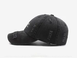 Detailed side view of dark grey distressed baseball cap with 3D TER embroidery
