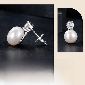 Detail view of S925 sterling silver threaded earrings with moissanite and freshwater pearl