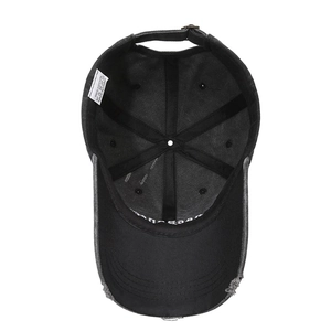 Distressed black cotton baseball cap showing internal 100% cotton label and metal buckle