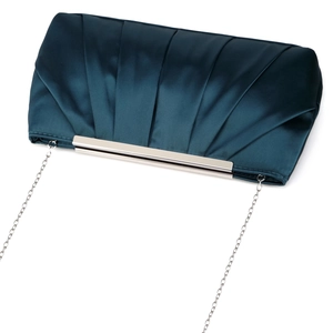 Detailed view of dark teal pleated satin evening bag with silver chain strap and metal frame