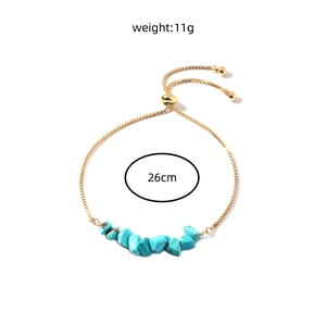 Detail view of bohemian turquoise bead gold chain bracelet with adjustable slider