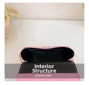 Internal structure of the pink girls crossbody bag with black lining and gold chain strap