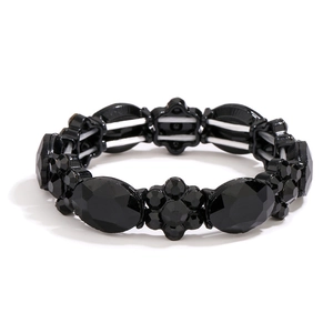 Elastic black beaded bracelet with faceted stones and floral alloy components