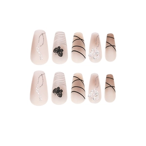 Pink gradient press-on nails featuring black butterfly art and silver glitter wavy lines
