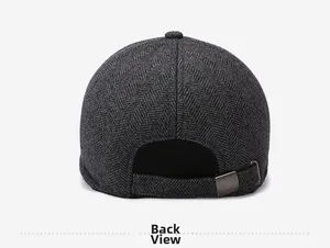 Detail view of the deep grey herringbone wool cap back with adjustable metal buckle strap