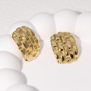 18k gold plated stainless steel stud earrings with elegant woven texture on a white tray