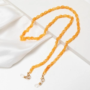 Translucent orange acrylic mask and eyeglass chain with gold metal lobster clasps