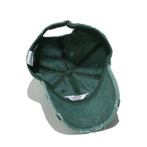 Detailed interior of vintage cotton baseball cap with adjustable metal buckle and stitching