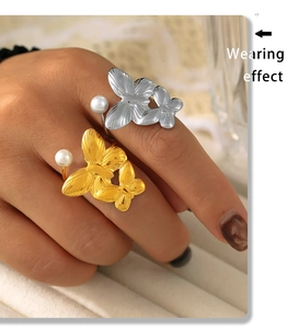 Wearing effect of adjustable butterfly and pearl rings in gold and silver finish