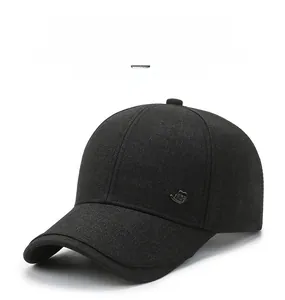 Detail of the black baseball cap showing the breathable fabric and small metal logo JZC