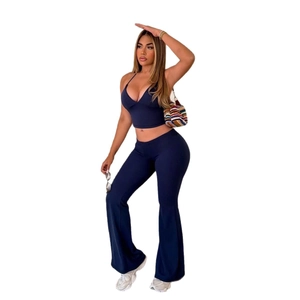 Slim fit navy blue two-piece set with a cropped top and high-waisted flared pants