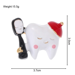Detail view of tooth enamel brooch with size measurements 3.7cm width and 3.0cm height