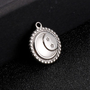 Polished stainless steel round pendant with embossed celestial star and moon motifs