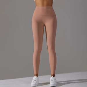 Detailed back view of high-waisted seamless peach lift yoga pants in cinnamon pink color