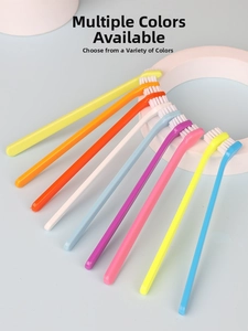 Detail of multi-colored pet toothbrushes with angled heads and dense white bristles