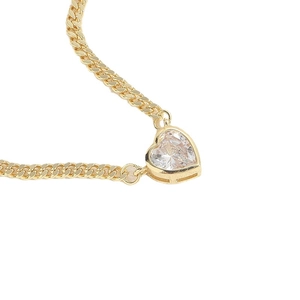 Elegant gold-tone Cuban chain necklace with a heart-shaped zircon gemstone pendant