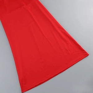 Detail of red backless dress showing high-quality stitching and elastic knit texture