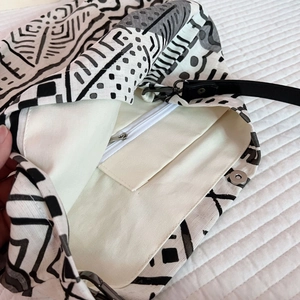 Close-up of bohemian tote with geometric patterns, inner zipper pocket and magnetic snap