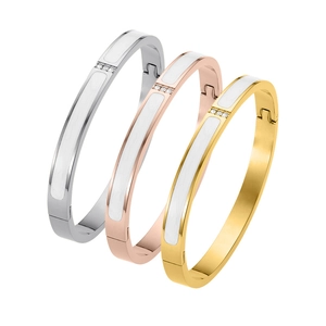 Three-piece set of 18K gold-plated stainless steel bangles with white enamel and rhinestones