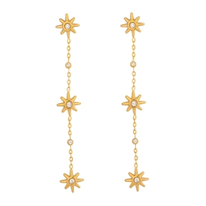 Detail view of triple star sun gold drop earrings with zircon insets on chains