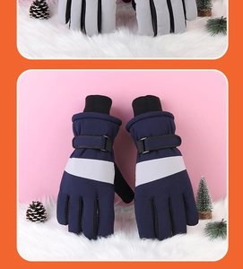 Detail of waterproof winter gloves showing adjustable wrist straps and knit cuffs