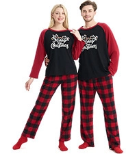 Detailed view of Merry Christmas lettering on raglan sleeve pajama top and plaid pants