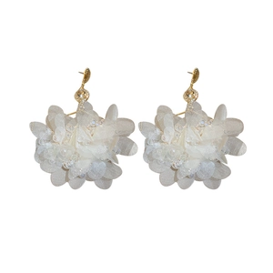 Exaggerated floral drop earrings with off-white fabric petals and clear beads