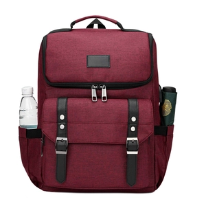 Maroon Oxford backpack detail with multi-layered zipper compartments and side pockets